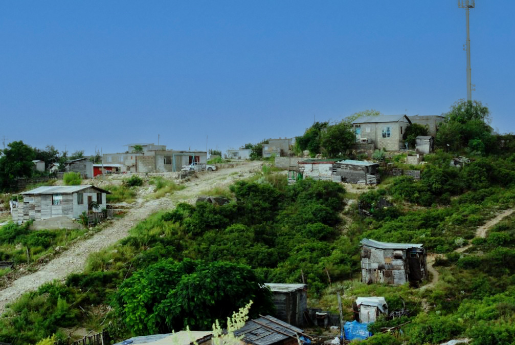 Volunteers walking the dirt roads in the colonias